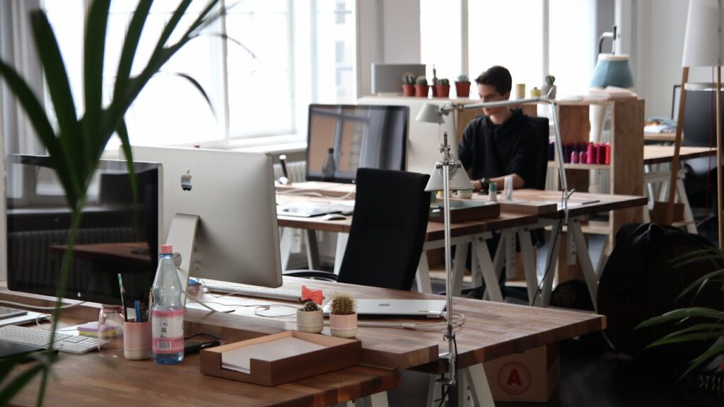 Open-plan office with modern decor and natural lighting, ideal for productivity.